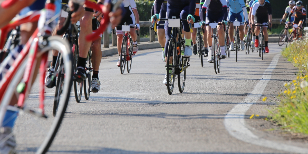 many race bike and professional cyclists during the cycling race on asphalt road